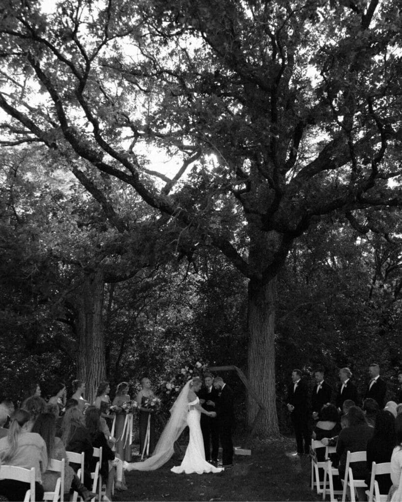 Couple exchanging rings during their fall wedding ceremony in Rockton Illinois.
